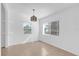 Bright dining room with neutral walls and tile floors bathed in natural light at 1725 Marcia Dr, Orlando, FL 32807