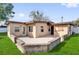 Charming single-story home with a concrete patio area perfect for outdoor entertaining at 1725 Marcia Dr, Orlando, FL 32807