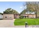 Charming single-story home with well-maintained lawn and inviting curb appeal at 1725 Marcia Dr, Orlando, FL 32807