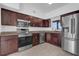 Well-equipped kitchen with stainless steel appliances and stylish cabinetry for cooking at 1725 Marcia Dr, Orlando, FL 32807