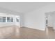 Spacious living room with neutral tile flooring and a large window at 1725 Marcia Dr, Orlando, FL 32807