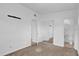 Bright primary bedroom with plush carpet, a closet, and an adjoining bathroom at 1725 Marcia Dr, Orlando, FL 32807