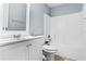 Bathroom featuring a sink, mirror, toilet, and bathtub with shower head at 1802 Hagen Ct, St Cloud, FL 34771