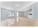 Bright, open living room with tile floors, neutral walls, and plenty of space for entertaining and relaxation at 1802 Hagen Ct, St Cloud, FL 34771