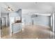 Open-concept living room features high ceilings and tile floors, seamlessly flowing into the kitchen area at 1802 Hagen Ct, St Cloud, FL 34771