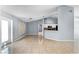 Open-concept living space featuring tile floors, views of the kitchen, dining area, and front entrance at 1802 Hagen Ct, St Cloud, FL 34771