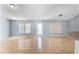 Bright living area with tile flooring and large windows bringing in natural light, located near the kitchen area at 1802 Hagen Ct, St Cloud, FL 34771