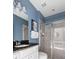 Stylish bathroom featuring dual sinks, granite countertops and a tiled glass shower enclosure at 1864 Nice Ct, Kissimmee, FL 34747
