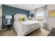 Bright bedroom with a large bed, modern decor, and plenty of natural light from the window at 1864 Nice Ct, Kissimmee, FL 34747