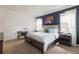 Comfortable bedroom with a large bed, a desk, and modern decor with lots of light from the windows at 1864 Nice Ct, Kissimmee, FL 34747