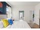 Bedroom with bright colors and a large comfortable bed with a view from the windows at 1864 Nice Ct, Kissimmee, FL 34747