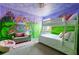 The themed bedroom offers bunk beds and muraled walls for a unique and playful atmosphere at 1864 Nice Ct, Kissimmee, FL 34747