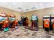 Fun game room featuring multiple arcade games, carpeting and recessed lighting for residents to enjoy at 1864 Nice Ct, Kissimmee, FL 34747