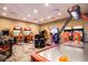 Community game room features various arcade games and an air hockey table for residents' entertainment at 1864 Nice Ct, Kissimmee, FL 34747
