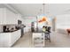 Modern kitchen features stainless steel appliances, granite counters, and island with seating at 1864 Nice Ct, Kissimmee, FL 34747