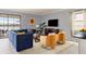 Bright living room features sliding glass doors to patio and modern furnishings at 1864 Nice Ct, Kissimmee, FL 34747