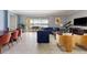 Bright living room with stylish furnishings, opening to a patio and serene lake views for relaxed living at 1864 Nice Ct, Kissimmee, FL 34747