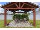 Gazebo with outdoor seating area is surrounded by plants, offering a relaxing outdoor space at 1942 N Portillo Dr, Deltona, FL 32738