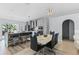 Eat-in kitchen featuring gray cabinets, stainless steel appliances, island seating, and stylish pendant lighting at 1942 N Portillo Dr, Deltona, FL 32738