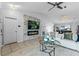 Open-concept living space featuring a vaulted ceiling, modern fireplace, and durable and stylish flooring at 1942 N Portillo Dr, Deltona, FL 32738