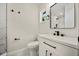 Bathroom features sleek vanity, black hardware, and tiled shower at 2015 N Hastings St, Orlando, FL 32808
