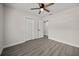 Neutral bedroom featuring modern gray flooring, ceiling fan, and closet at 2015 N Hastings St, Orlando, FL 32808