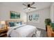 Bright main bedroom with a ceiling fan, large window, and stylish decor at 2015 N Hastings St, Orlando, FL 32808
