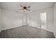 Bright bedroom with ceiling fan leading to the bathroom and features a closet at 2015 N Hastings St, Orlando, FL 32808