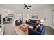 Bright living room featuring modern furniture, decor, ceiling fan, and gray-toned wood floors at 2015 N Hastings St, Orlando, FL 32808