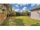 Enjoy the privacy and shade of this large backyard with mature trees, perfect for outdoor activities and relaxation at 203 Red Bud Ct, Lake Mary, FL 32746
