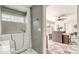 Bathroom with tub, glass block window, and access to a patio bar with an umbrella table at 203 Red Bud Ct, Lake Mary, FL 32746