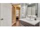 Bathroom features vanity and sink, with a view of a bedroom in the background at 203 Red Bud Ct, Lake Mary, FL 32746