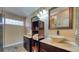 Bathroom featuring double sinks, stylish stone bowls, and decorative tiles at 203 Red Bud Ct, Lake Mary, FL 32746