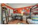 bedroom with red accent wall with cartoon characters, a lofted bed, and wood flooring at 203 Red Bud Ct, Lake Mary, FL 32746