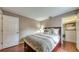 Cozy bedroom with hardwood floors, soft bedding, and a closet at 203 Red Bud Ct, Lake Mary, FL 32746