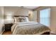 Inviting bedroom with a wood frame bed, soft pillows, and bright natural light at 203 Red Bud Ct, Lake Mary, FL 32746