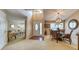 Open-concept entry with dining area and living room, showcasing natural light and seamless flow at 203 Red Bud Ct, Lake Mary, FL 32746