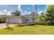 Charming single-Gathering home featuring a paver driveway, attached garage, and lush landscaping at 203 Red Bud Ct, Lake Mary, FL 32746