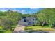 Charming single-Gathering home featuring a paver driveway, attached garage, and lush landscaping at 203 Red Bud Ct, Lake Mary, FL 32746