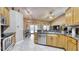 Kitchen featuring granite countertops and tile flooring with backyard view at 203 Red Bud Ct, Lake Mary, FL 32746