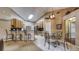 Kitchen and dining area with stainless steel appliances, ample counter space, and modern lighting at 203 Red Bud Ct, Lake Mary, FL 32746