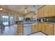 Kitchen with backyard view, granite countertops, stainless steel appliances, and bar seating at 203 Red Bud Ct, Lake Mary, FL 32746