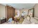 Living room with stylish wicker cabinet, comfortable seating, and open access to adjacent rooms at 203 Red Bud Ct, Lake Mary, FL 32746