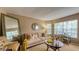 Cozy living room with ample natural light and comfortable seating, perfect for relaxation and gatherings at 203 Red Bud Ct, Lake Mary, FL 32746