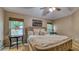 Comfortable main bedroom with natural light, side tables and plush decor at 203 Red Bud Ct, Lake Mary, FL 32746