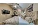 Relaxing main bedroom with a TV, dresser, and inviting neutral tones at 203 Red Bud Ct, Lake Mary, FL 32746