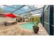 Enjoy the Florida lifestyle in this screened-in pool area with plenty of room for relaxation and entertainment at 203 Red Bud Ct, Lake Mary, FL 32746
