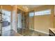 Modern walk-in shower with glass enclosure and tiled walls, offering a spa-like experience at 203 Red Bud Ct, Lake Mary, FL 32746