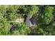 This aerial view showcases a private home site surrounded by mature trees and lush forest at 2225 E Welch Rd, Apopka, FL 32712