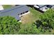 This aerial view of the back yard features privacy and a peaceful view with mature trees at 2225 E Welch Rd, Apopka, FL 32712